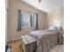 Cozy bedroom with hardwood floors, neutral walls, window, and soft light at 2204 W San Miguel Ave, North Las Vegas, NV 89032