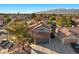 A well-maintained home with a neatly landscaped front yard and a two-car garage at 2204 W San Miguel Ave, North Las Vegas, NV 89032