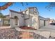 Beautiful two-story house with a red tile roof, arched entryway, and manicured landscaping at 2204 W San Miguel Ave, North Las Vegas, NV 89032