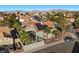 Aerial view of a well-maintained home with modern solar panels and desert landscaping in a quiet residential neighborhood at 2204 W San Miguel Ave, North Las Vegas, NV 89032