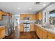 Updated kitchen with stainless steel appliances, natural wood cabinetry and flooring at 2204 W San Miguel Ave, North Las Vegas, NV 89032