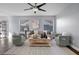 Bright living room featuring a ceiling fan, modern decor, and neutral color palette at 2204 W San Miguel Ave, North Las Vegas, NV 89032