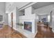 Cozy living room features a tile-surround fireplace and open access to other rooms at 2204 W San Miguel Ave, North Las Vegas, NV 89032