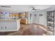 Open living area with hardwood floors, bright light, ceiling fans and open access to the kitchen at 2204 W San Miguel Ave, North Las Vegas, NV 89032