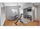 Loft area with an exercise bike, beanbag chair, and floor-to-ceiling windows at 2204 W San Miguel Ave, North Las Vegas, NV 89032