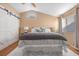 Spacious bedroom with a ceiling fan, barn door closet, and carpet at 2204 W San Miguel Ave, North Las Vegas, NV 89032