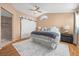 Bright main bedroom with ceiling fan, barn door closet and en-suite bathroom at 2204 W San Miguel Ave, North Las Vegas, NV 89032