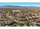 Expansive aerial view of a well-planned community, highlighted by orderly streets, lush greenery, and comfortable Gathering homes at 2204 W San Miguel Ave, North Las Vegas, NV 89032