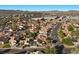Picturesque aerial shot of a neighborhood displaying neat homes, verdant trees, and convenient proximity to commercial areas at 2204 W San Miguel Ave, North Las Vegas, NV 89032