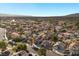 An elevated view showcasing a tranquil residential area with mature trees and beautiful single-Gathering homes under a bright sky at 2204 W San Miguel Ave, North Las Vegas, NV 89032