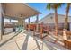Covered patio showcasing outdoor seating and a charming deck area at 2204 W San Miguel Ave, North Las Vegas, NV 89032