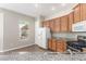 Modern kitchen with wood cabinets, granite countertops, and stainless steel appliances at 224 Morgyn Ln # 6, Boulder City, NV 89005