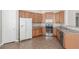 Well-equipped kitchen features stainless steel appliances and wood cabinetry at 224 Morgyn Ln # 6, Boulder City, NV 89005