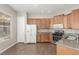 Kitchen showcases wood cabinets, tile floors, stainless appliances, and natural light at 224 Morgyn Ln # 6, Boulder City, NV 89005