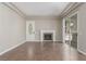 Inviting living room with tiled flooring, fireplace and ample natural light from sliding glass door at 224 Morgyn Ln # 6, Boulder City, NV 89005