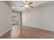 Spacious living room featuring a ceiling fan, tile floors and a sliding glass door at 224 Morgyn Ln # 6, Boulder City, NV 89005