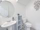 Well lit bathroom with large round mirror and modern fixtures at 261 Fairway Woods Dr, Las Vegas, NV 89148