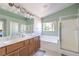 Bright bathroom with double sink vanity, shower, and soaking tub at 261 Fairway Woods Dr, Las Vegas, NV 89148