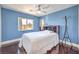 Cozy bedroom with modern ceiling fan and plenty of natural light at 261 Fairway Woods Dr, Las Vegas, NV 89148