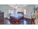Spacious bedroom featuring dark wood floors and natural light at 261 Fairway Woods Dr, Las Vegas, NV 89148