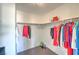 Walk-in closet with wood floors and ample storage at 261 Fairway Woods Dr, Las Vegas, NV 89148