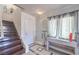 Inviting entryway with wood stairs, decorative console table, and stylish light fixture at 261 Fairway Woods Dr, Las Vegas, NV 89148