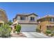 Charming two-story home featuring a two-car garage and well-maintained landscaping in a desirable neighborhood at 261 Fairway Woods Dr, Las Vegas, NV 89148