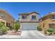 Charming two-story home with a well-maintained front yard, two car garage, and inviting entrance at 261 Fairway Woods Dr, Las Vegas, NV 89148