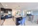 Spacious kitchen with granite countertops, stainless steel appliances, dark cabinetry, and an island at 261 Fairway Woods Dr, Las Vegas, NV 89148