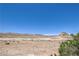 Wide-angle view of the desert landscape surrounding the neighborhood on a sunny day at 261 Fairway Woods Dr, Las Vegas, NV 89148