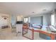 Bright living room with tile flooring, neutral decor, and ample seating at 261 Fairway Woods Dr, Las Vegas, NV 89148
