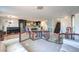 Open-concept living area with tiled floors, stairs, modern lighting, and seamlessly flowing spaces at 261 Fairway Woods Dr, Las Vegas, NV 89148
