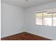 Bedroom featuring hardwood floors, light walls, and a window providing ample natural light at 2616 Spear St, North Las Vegas, NV 89030
