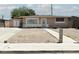 Charming single-story home with gravel front yard and sidewalk leading to the entrance at 2616 Spear St, North Las Vegas, NV 89030