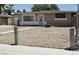 View of a single-story home featuring a gravel front yard and a walkway to the front door at 2616 Spear St, North Las Vegas, NV 89030
