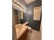 Bathroom features a single sink vanity, walk-in shower, and tile floors at 2695 Olivia Heights Ave, Henderson, NV 89052