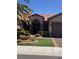 Charming front entrance featuring a meticulously landscaped yard and decorative security door at 2695 Olivia Heights Ave, Henderson, NV 89052