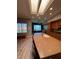 Bright eat-in kitchen with an island, skylight, and views of the lake at 2695 Olivia Heights Ave, Henderson, NV 89052