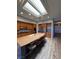 Spacious kitchen features a large island, stainless steel appliances, and a bright skylight at 2695 Olivia Heights Ave, Henderson, NV 89052