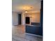 Neutral living room boasts new floors and modern lighting at 2695 Olivia Heights Ave, Henderson, NV 89052