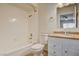 Clean bathroom with tiled tub, shower, and a marble-look vanity at 2785 Carnation Ln # 0, Henderson, NV 89074