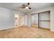 Bedroom featuring sliding closet doors, a ceiling fan, and bathroom entrance at 2785 Carnation Ln # 0, Henderson, NV 89074