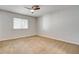 Neutral bedroom featuring a ceiling fan and a window offering natural light at 2785 Carnation Ln # 0, Henderson, NV 89074