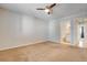 Spacious bedroom with a ceiling fan, leading into a bathroom and other rooms at 2785 Carnation Ln # 0, Henderson, NV 89074