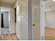 Hallway with utility closet and wood-look flooring provides easy access to the home's amenities at 2785 Carnation Ln # 0, Henderson, NV 89074