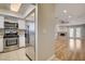 View from kitchen with stainless steel fridge into bright living room at 2785 Carnation Ln # 0, Henderson, NV 89074