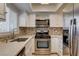 Updated kitchen features stainless steel appliances and tile backsplash at 2785 Carnation Ln # 0, Henderson, NV 89074