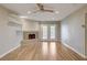 Bright living room with wood floors, fireplace, and ceiling fan at 2785 Carnation Ln # 0, Henderson, NV 89074