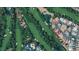 Aerial view of property and golf course with surrounding homes in community at 2851 Queens Courtyard Dr, Las Vegas, NV 89109