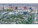 Stunning aerial view of the property's location near the city and golf course at 2851 Queens Courtyard Dr, Las Vegas, NV 89109